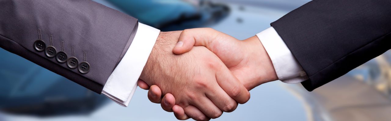 Friendly Hall's Auto Sales team assists a customer in finding their perfect pre-owned vehicle.
