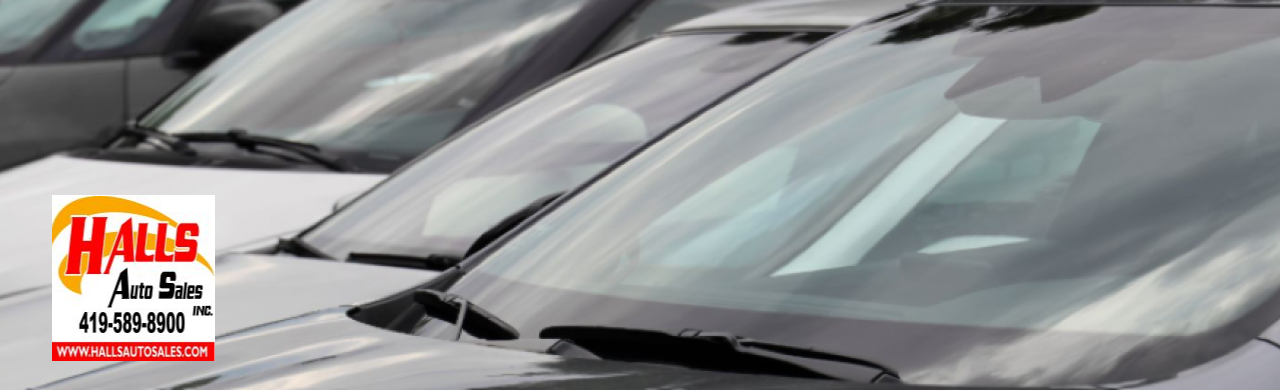 Customer browsing affordable SUVs at Hall’s Auto Sales, a trusted local car lot near Mansfield, Ohio.