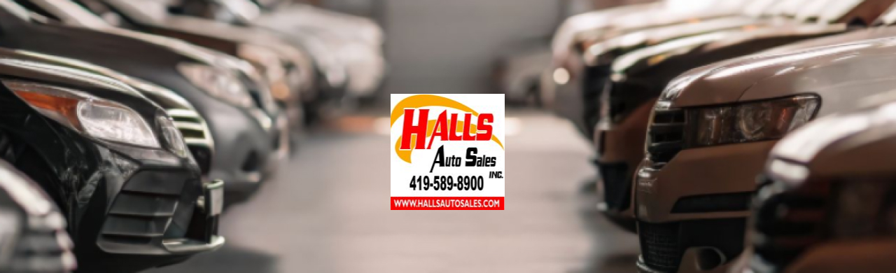 A wide selection of used cars lined up at Hall’s Auto Sales lot in Mansfield, OH.